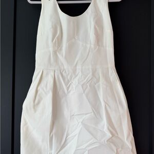 White sleeveless dress with beaded shoulders